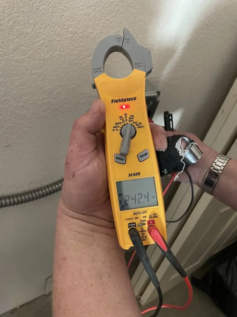 Voltage testing with clamp meter during Electrical Installation Services in Bellwood